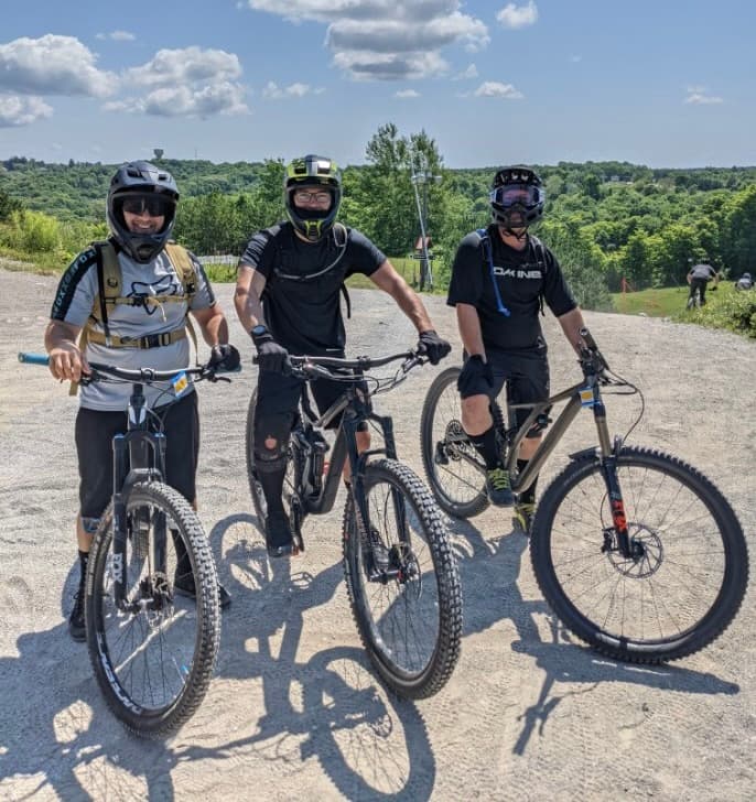 The SHREDMTB founders on their mountain bikes